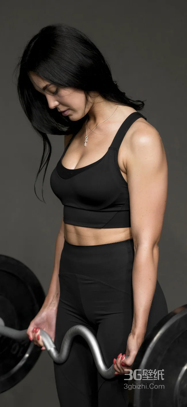 身材黑色紧身运动服正在健身的美女手机壁纸1